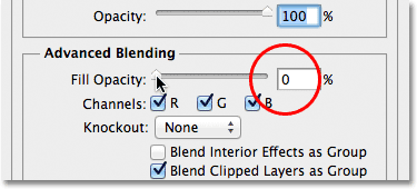 Lowering the Fill Opacity option to 0% in the Layer Style dialog box. Image &copy; 2012 Photoshop Essentials.com.
