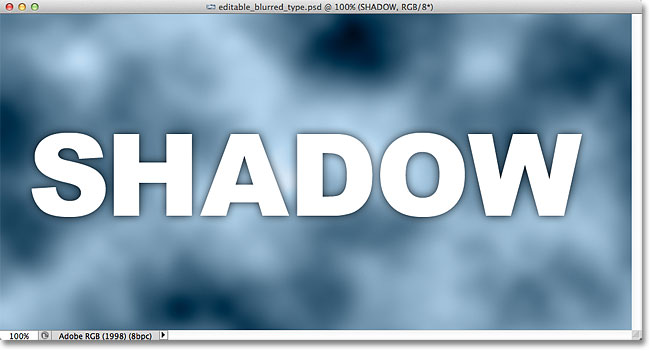 The drop shadow appears around the edges of the letters in the document window. Image &copy; 2012 Photoshop Essentials.com.