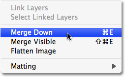 Selecting the Merge Down option in Photoshop. Image © 2009 Photoshop Essentials.com.