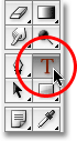 Memilih Type Tool di Photoshop. Gambar © 2009 Photoshop Essentials.com.