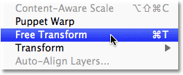 Choosing the Free Transform command from the Edit menu in Photoshop. Image &copy; 2011 Photoshop Essentials.com.