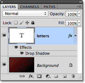 The Layers panel in Photoshop showing the text layer and the Background layer. Image &copy; 2011 Photoshop Essentials.com.