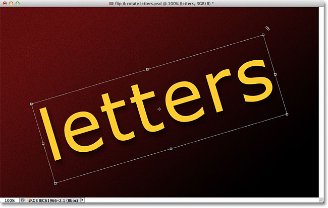 Rotating the text with Free Transform. Image &copy; 2011 Photoshop Essentials.com.