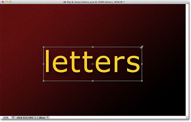 Scaling text in Photoshop with the Free Transform command. Image &copy; 2011 Photoshop Essentials.com.