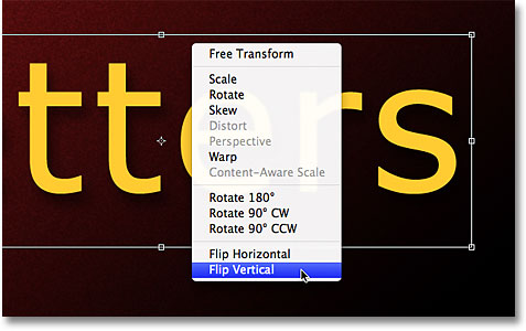 Selecting the Flip Vertical command from the Free Transform contextual menu. Image &copy; 2011 Photoshop Essentials.com.