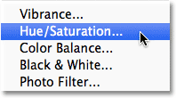 Choosing a Hue/Saturation adjustment layer in Photoshop. Image &copy; 2011 Photoshop Essentials.com.