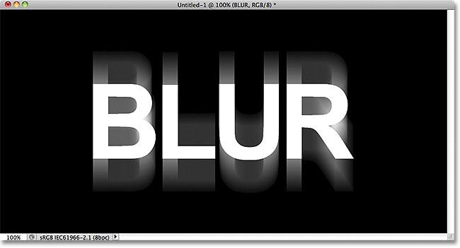 A vertical motion blur effect has been added to the text. Image &copy; 2011 Photoshop Essentials.com.