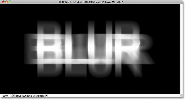 The text after drawing a reflected gradient on the layer mask. Image &copy; 2011 Photoshop Essentials.com.