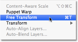 Selecting Free Transform from the Edit menu in Photoshop. Image © 2010 Photoshop Essentials.com.