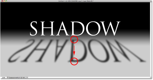 Dragging out a gradient on the layer mask. Image © 2010 Photoshop Essentials.com.