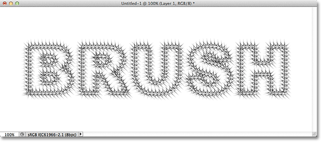 The starburst text stroke now appears darker after applying the brush a second time. Image &copy; 2011 Photoshop Essentials.com