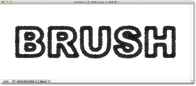 A stroke applied to a text path using the Rough Round Bristle brush in Photoshop. Image &copy; 2011 Photoshop Essentials.com
