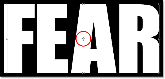 Adobe Photoshop Text Effects: The target icon in the center of the Free Transform box.