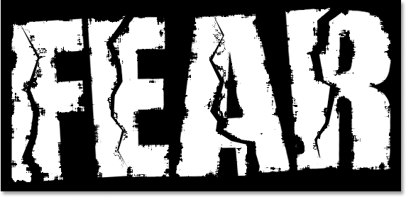 Adobe Photoshop Text Effects: The text after applying the Spatter filter.